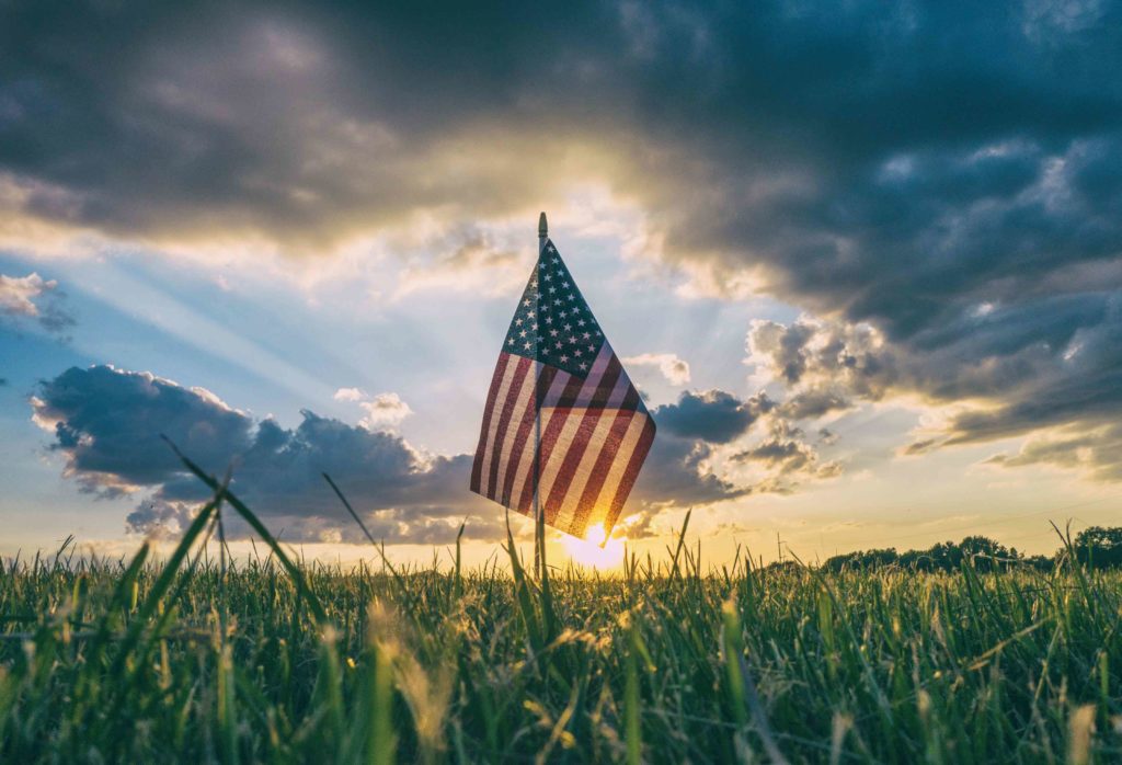 American flag in field of green