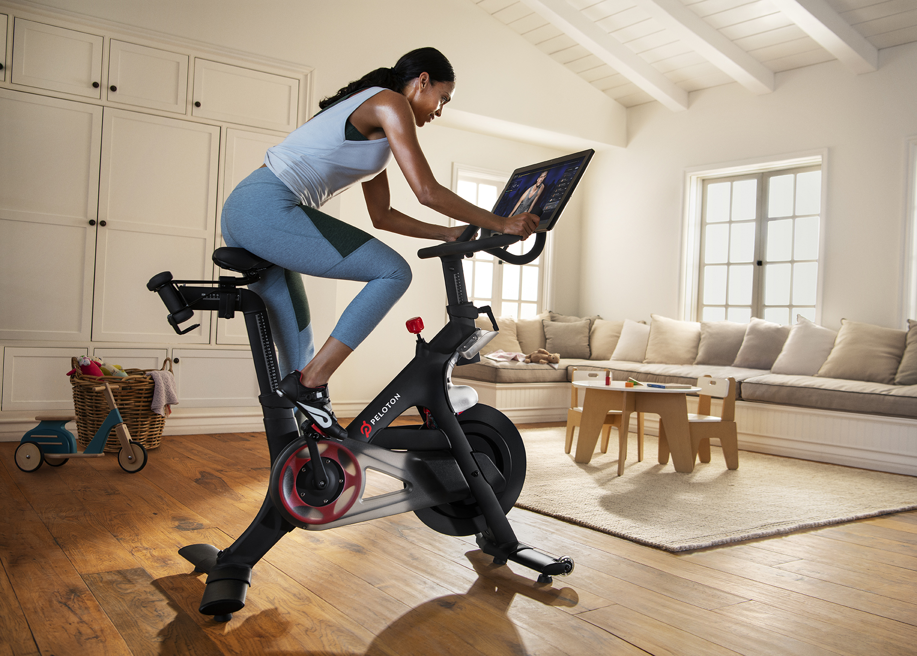 woman riding exercise bike